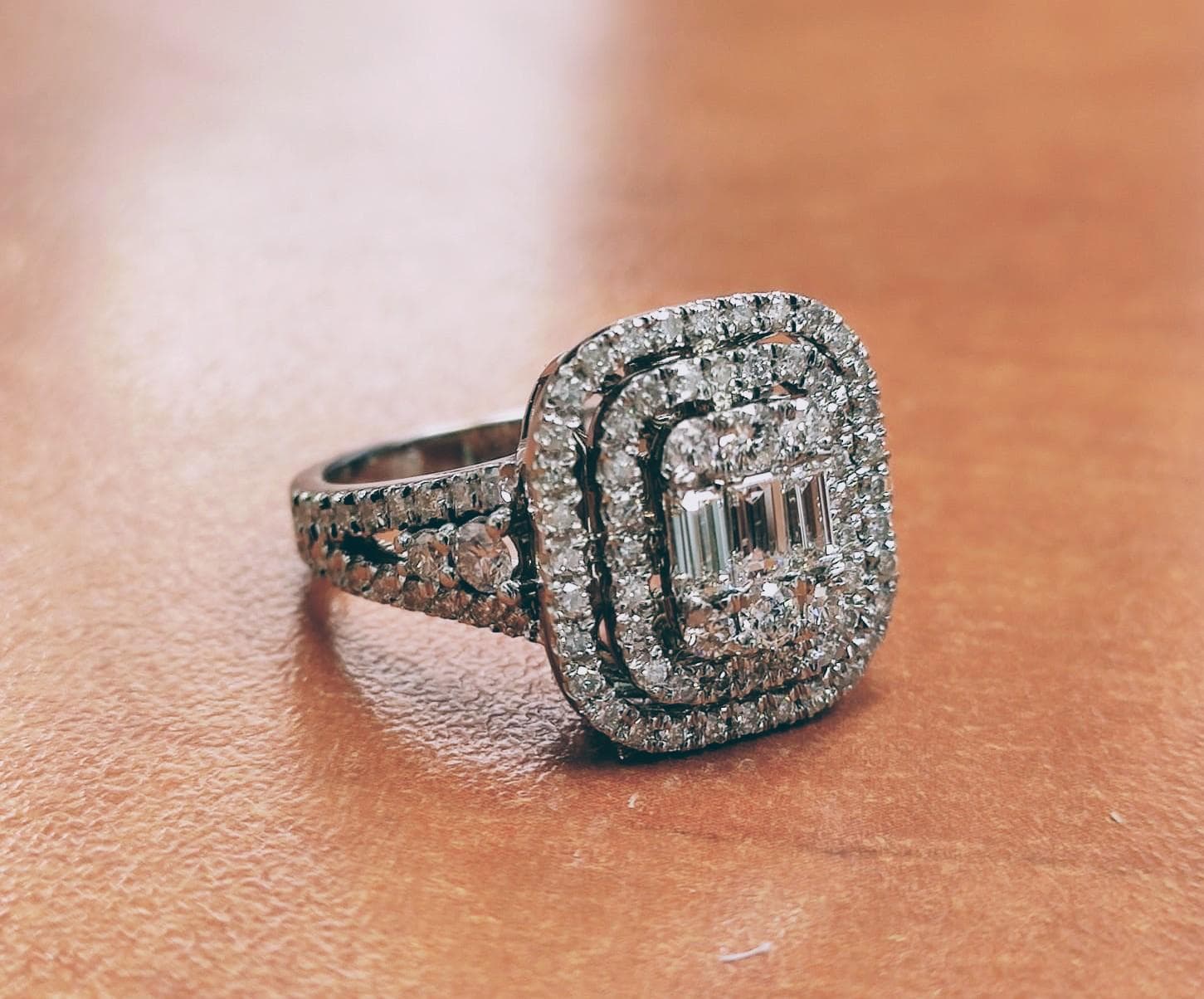 Double-halo cushion ring with baguettes