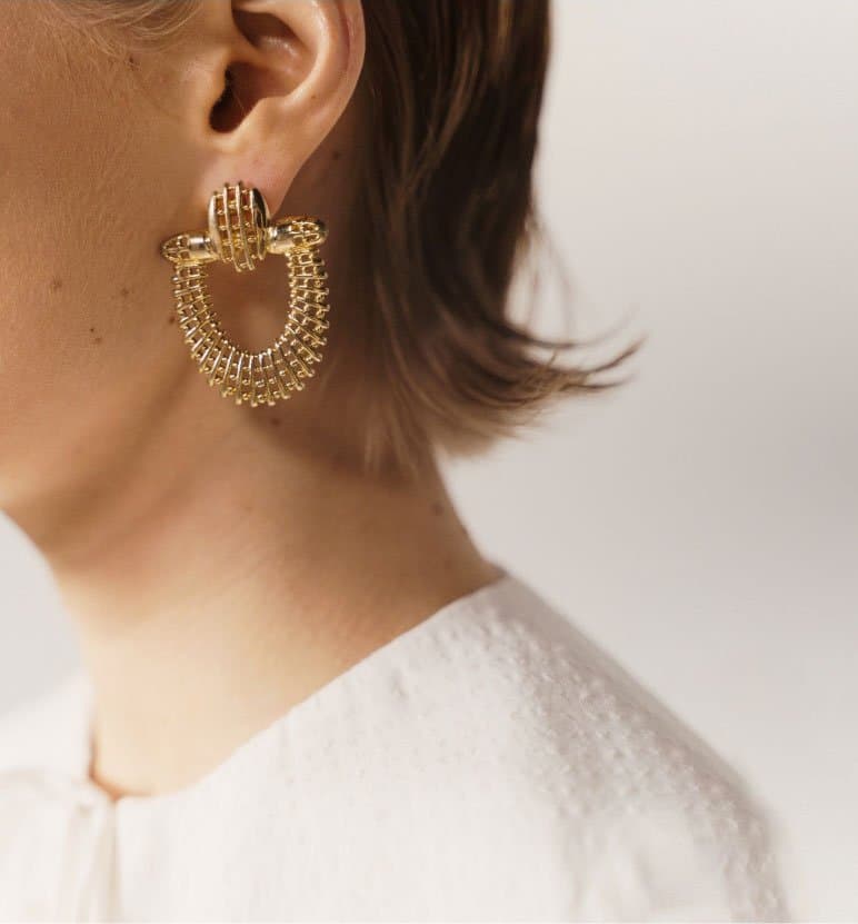 Close-up of Lady Diamond gold earrings