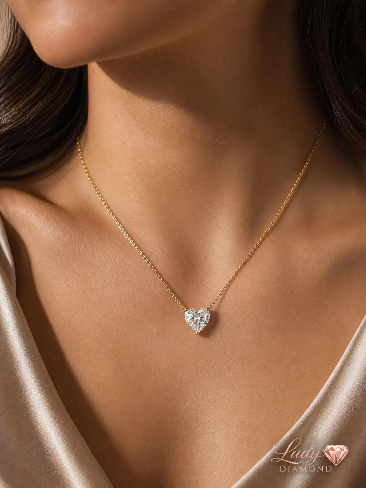 Yellow gold diamond heart necklace on the neck