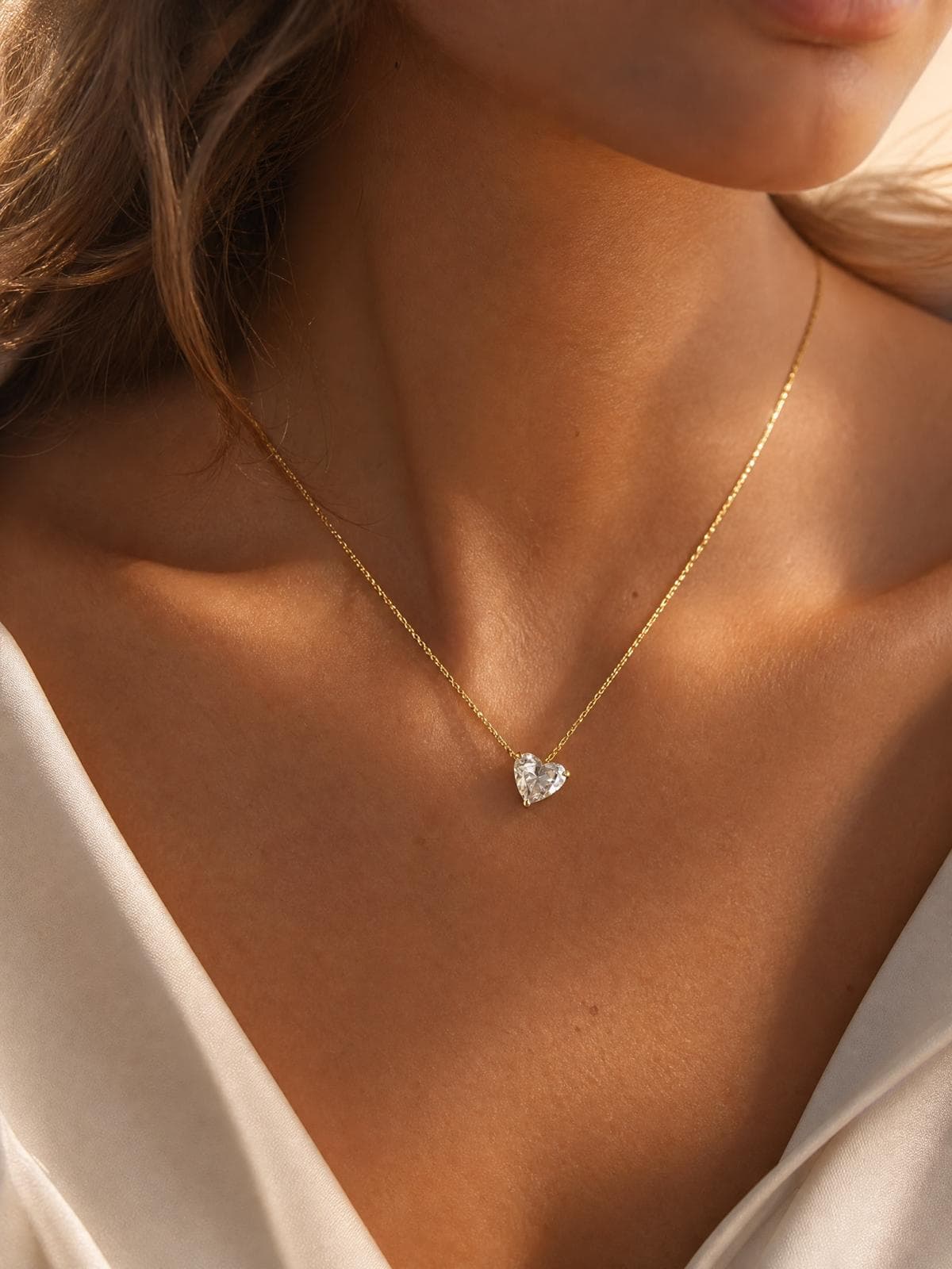 Yellow gold diamond heart necklace close-up